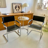 Pair of vintage chrome and black faux leather armchairs