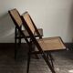 Paire de chaises pliantes cannées 1960