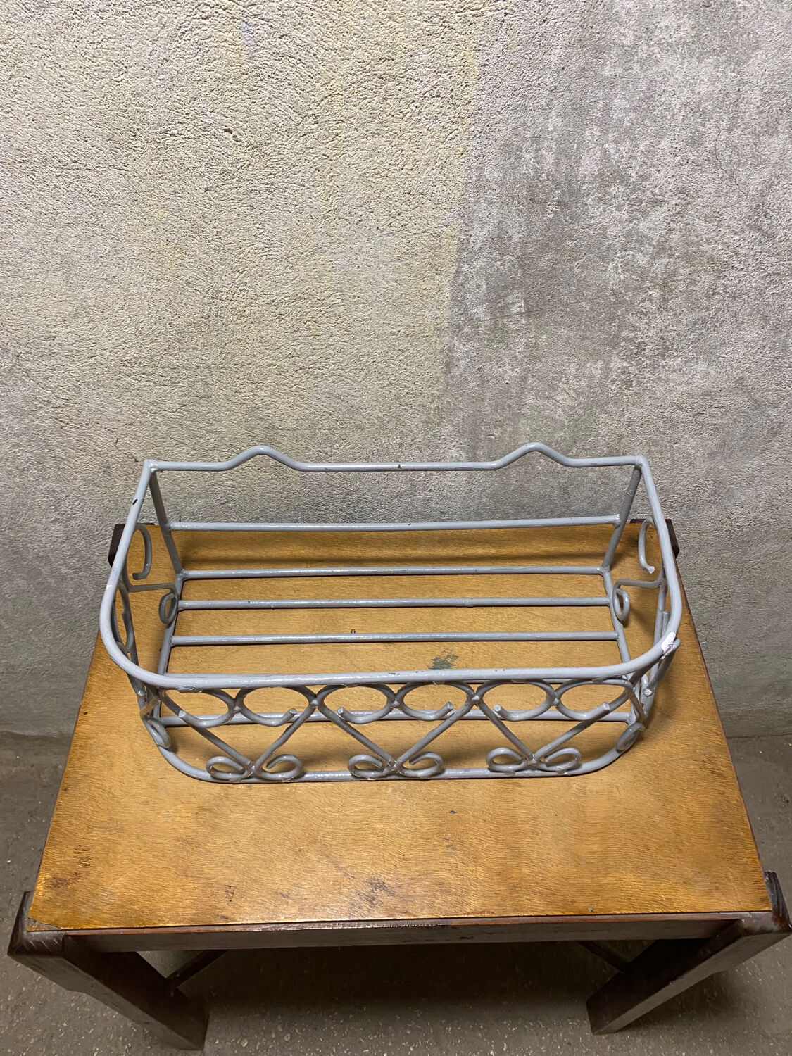 Gray wrought iron shelf