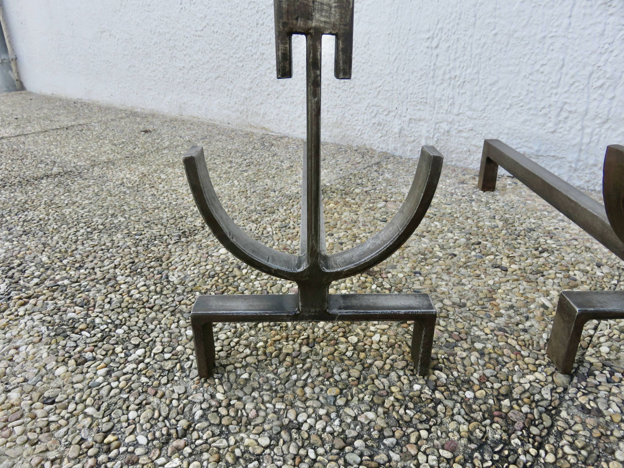 Pair of modernist andirons in forged and hammered steel, French work