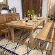 Solid oak extendable farmhouse table with 2 drawers.