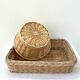Duo of baskets in braided rattan