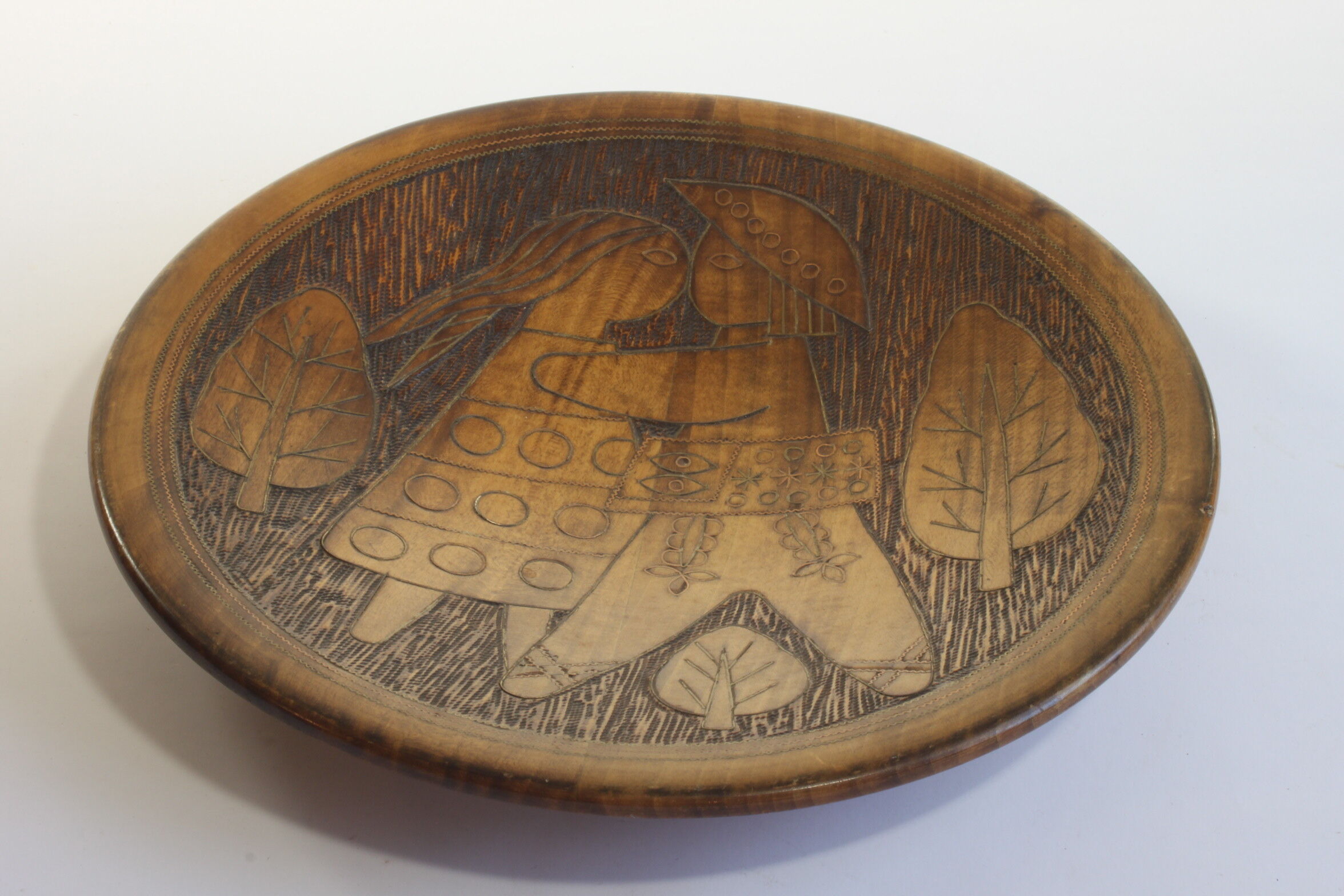 Scandinavian brass inlaid wooden plate with figures, 1960s.