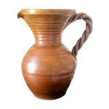 Sandstone jug with twisted handle