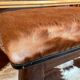 Vintage wooden and goatskin pouf