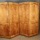 Large cherry wood folding screen with four double-sided panels.