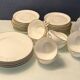 Service à thé en porcelaine (Limoges) 35 pieces monogrammè à liseré doré