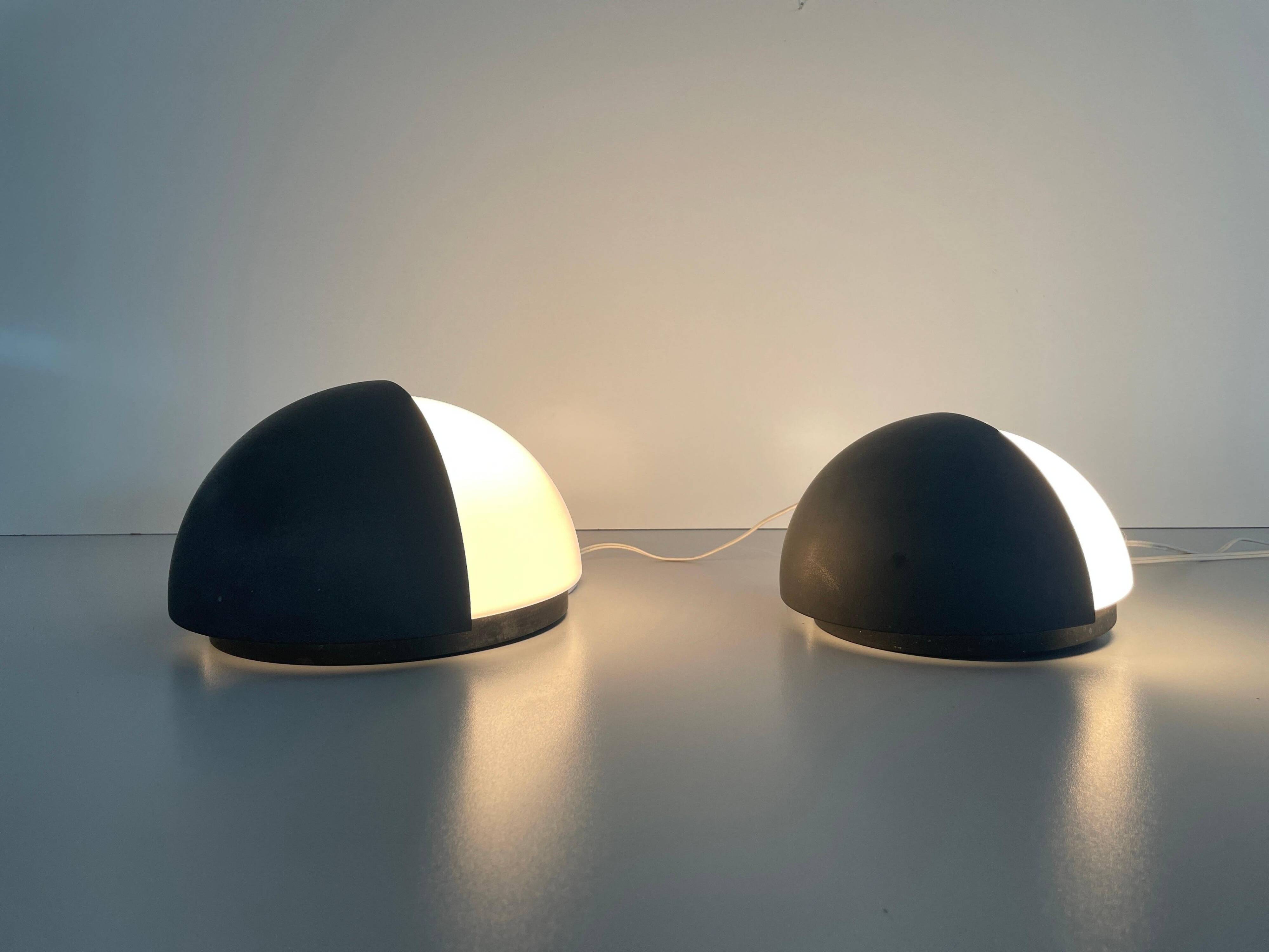 Round black metal wall lights, small and large set, by Bega, 1970s, Germany.