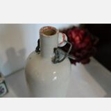 Sandstone bottle and porcelain cap