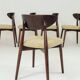 Green and walnut fabric dining chairs