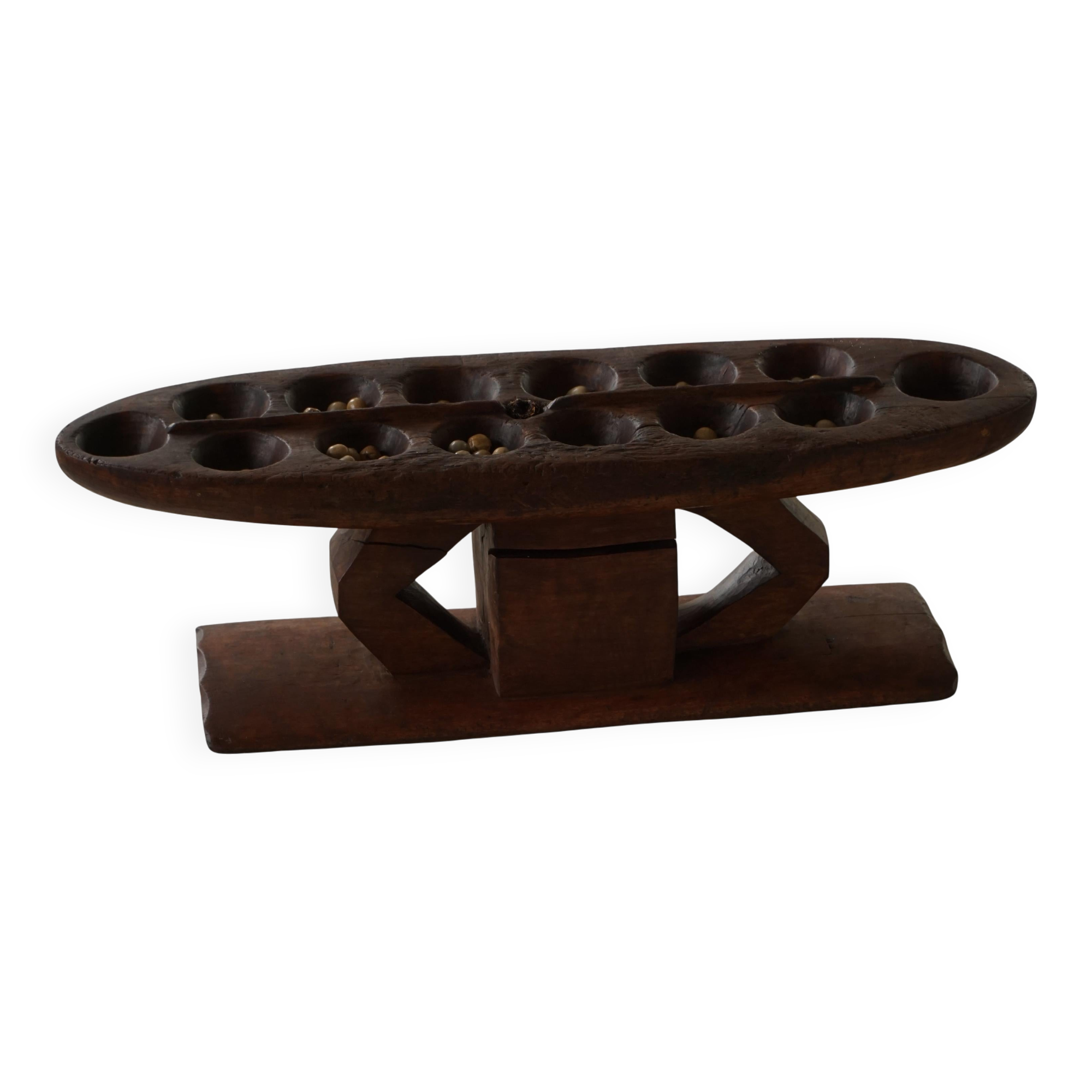 Decorative Mancala game board made of hand-carved wood, Africa, mid-20th century.