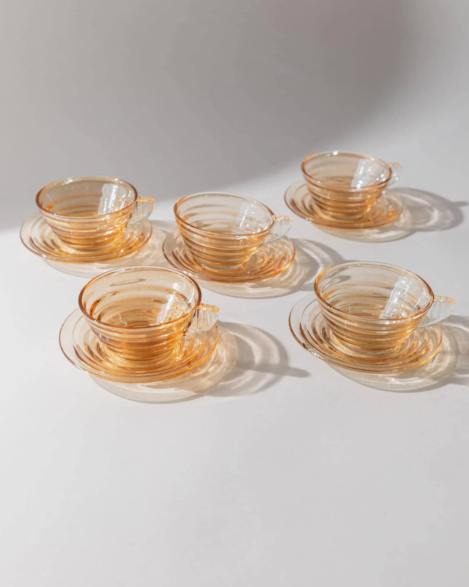 Vintage 1950s glass coffee cups, set of 5, iridescent peach ribbed glass with saucers, Italian design Gondolo.