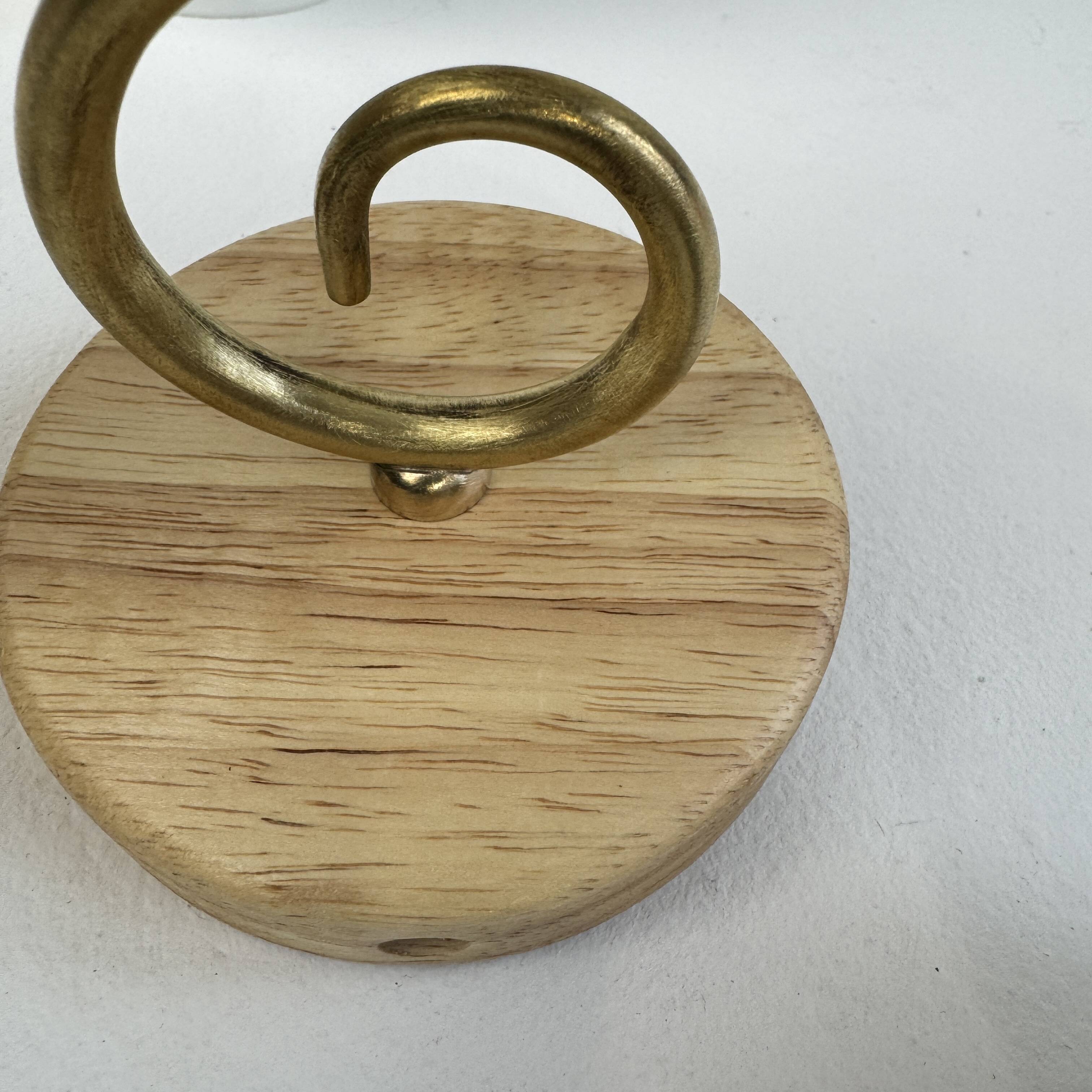 A pair of vintage opaline and brass wall lights