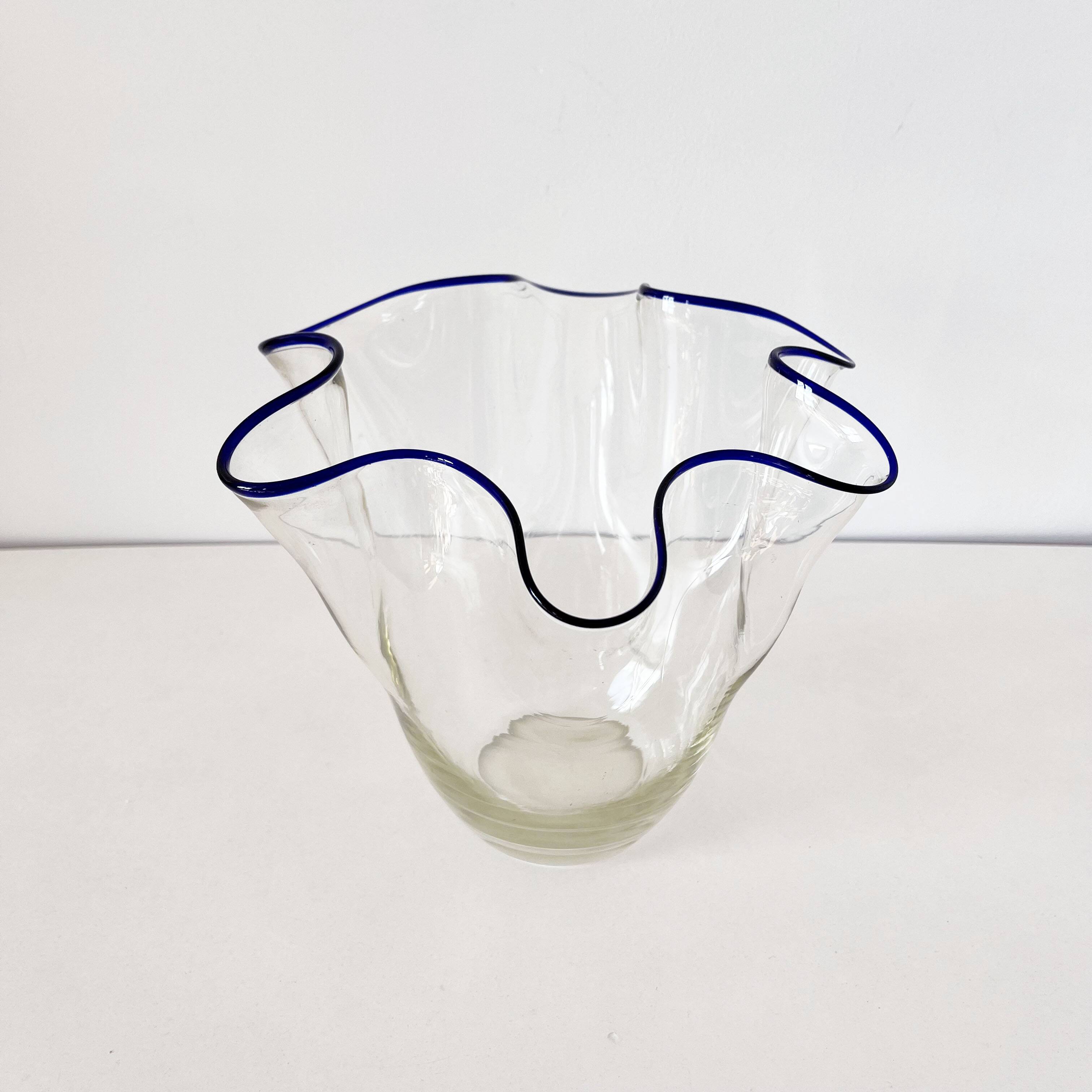 Blue-edged blown glass handkerchief vase