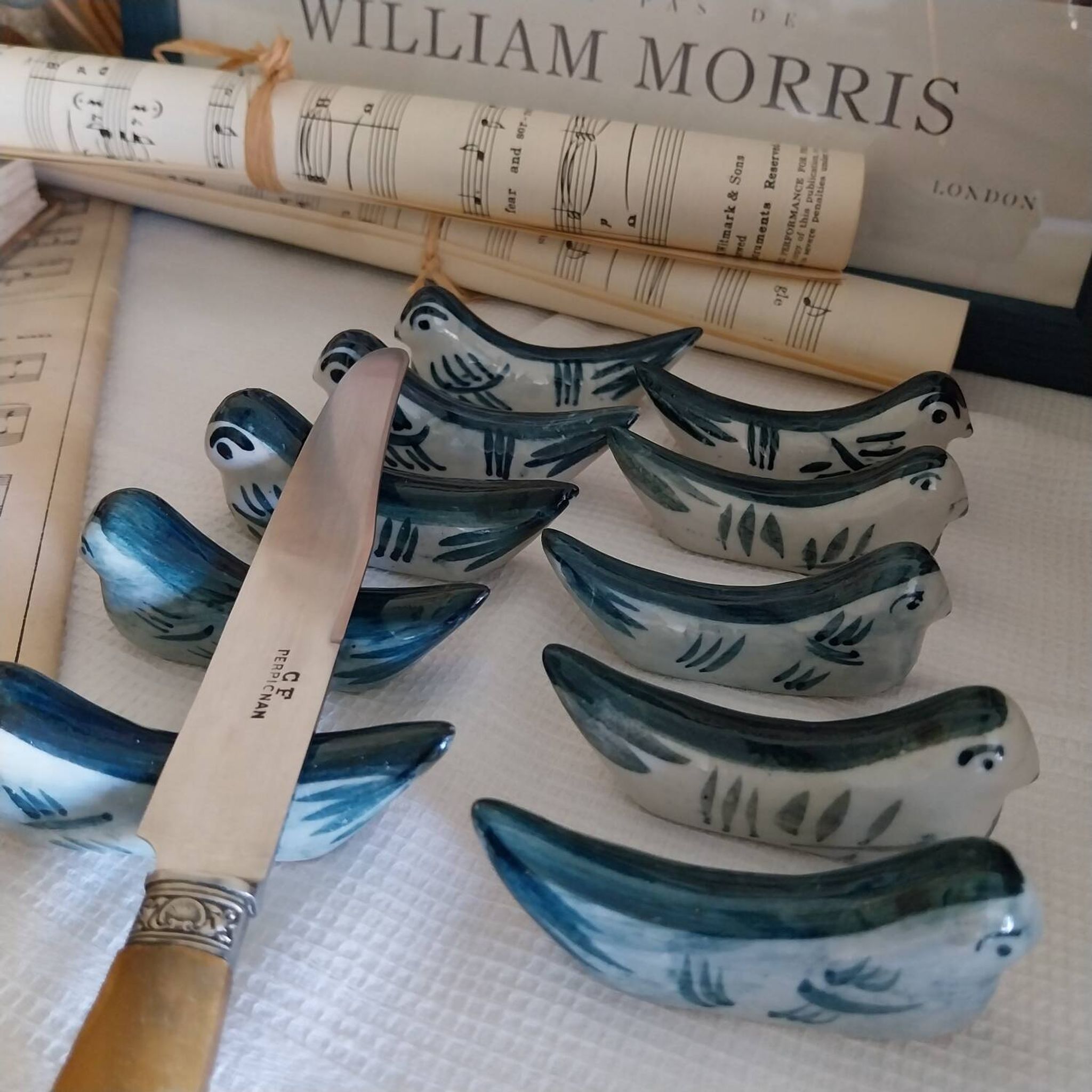 Ceramic knife rest in the shape of birds.
