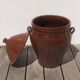 Large glazed terracotta jar, cognac colour with its lid.