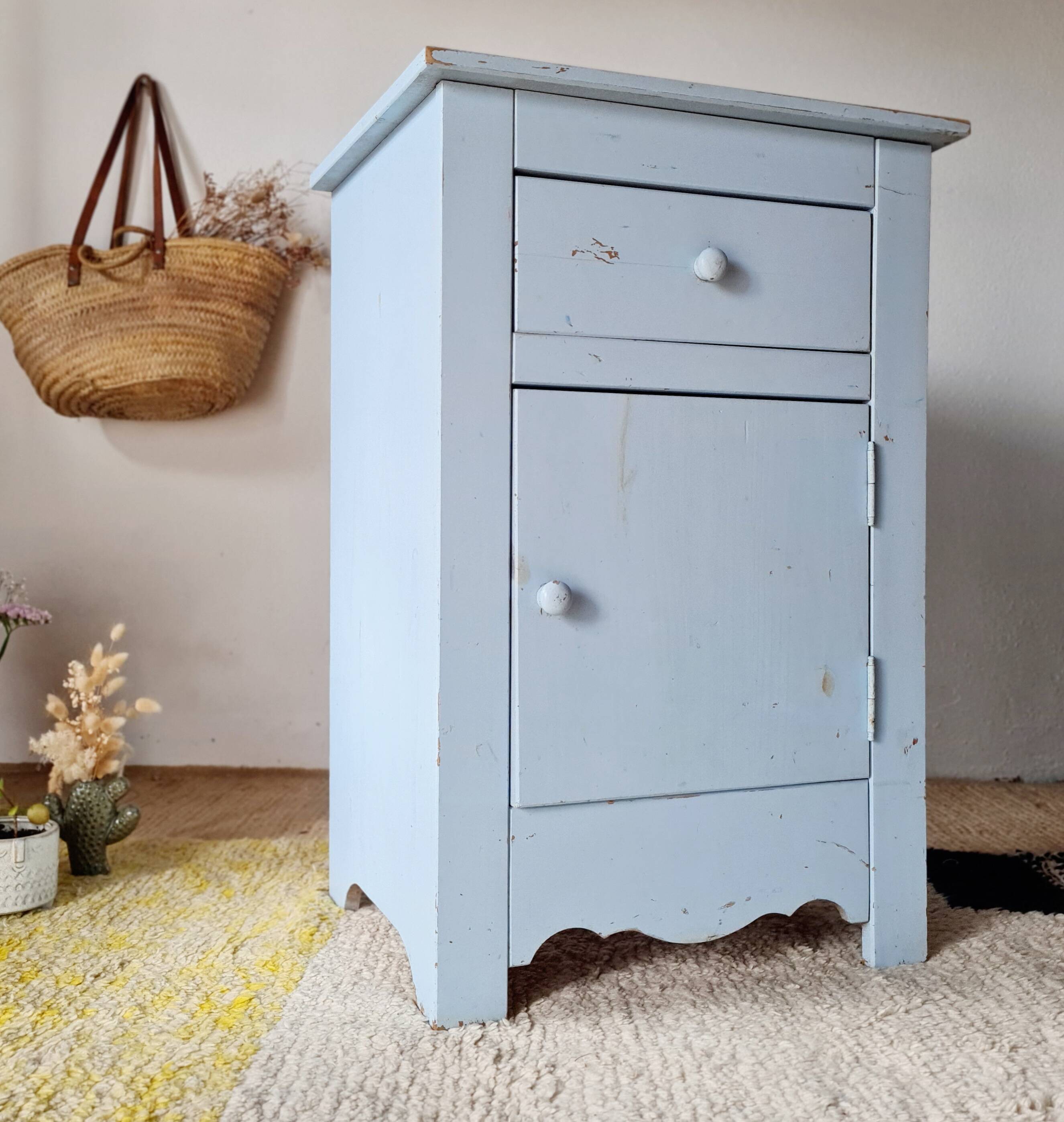 Handcrafted blue chest of drawers.
