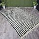 Handwoven traditional black and white Berber rug, size 250/150 cm.