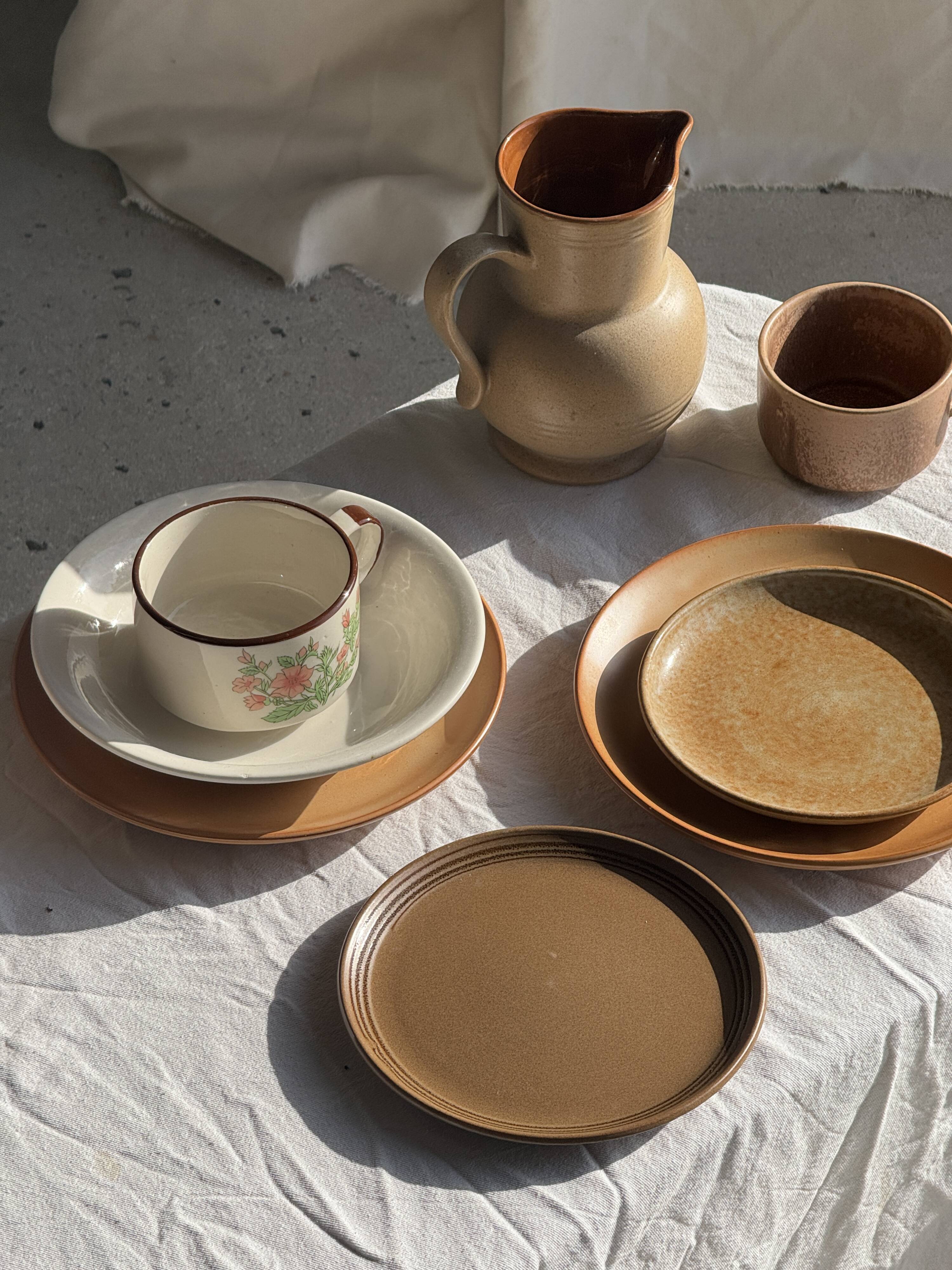Small speckled stoneware cup made in Korea with a floral pattern H7 D11