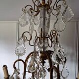 Lustre ancien à 8 bras de lumière à pampilles en bronze et cristal