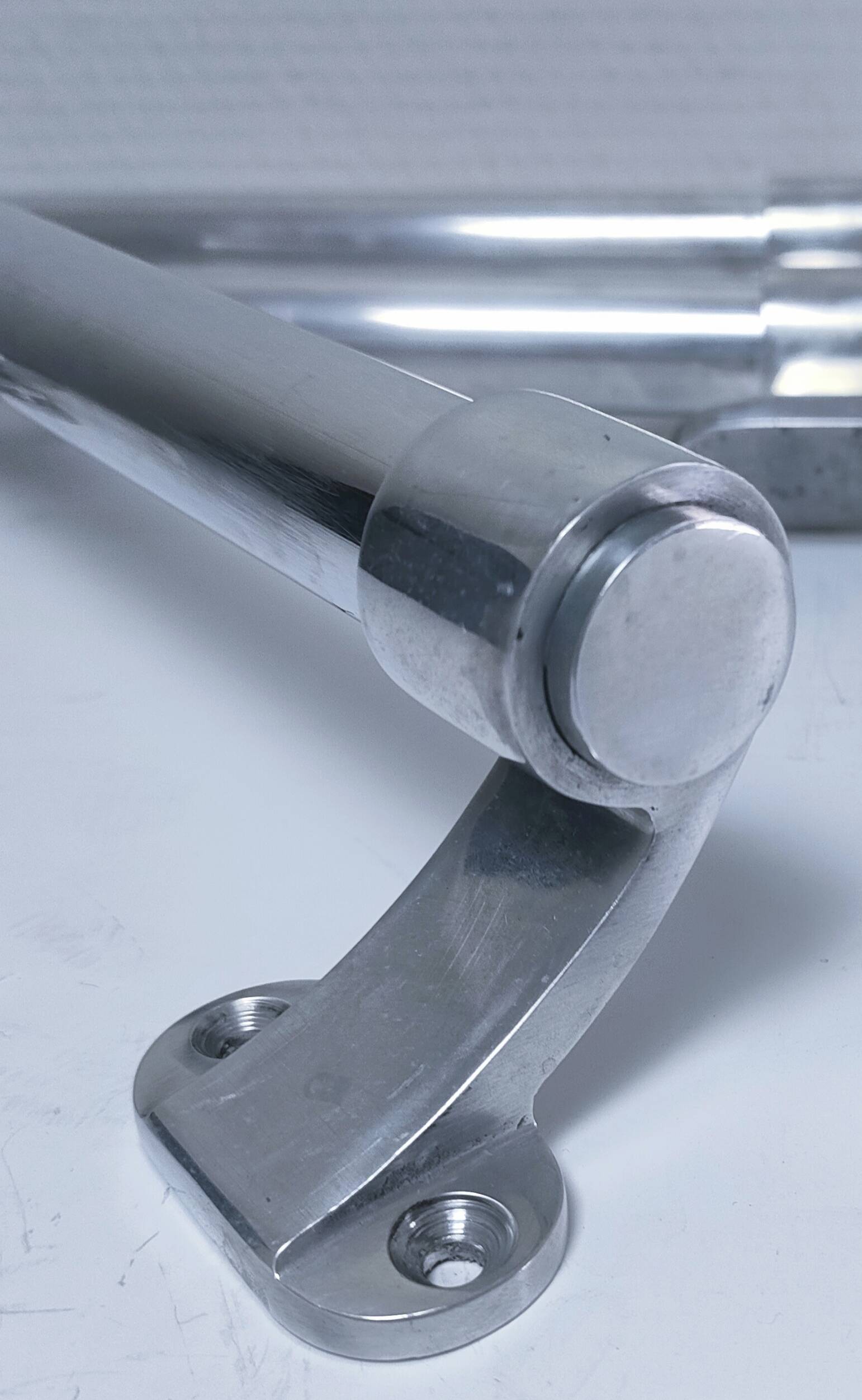 three long aluminum shop handles from the mid-20th century