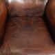 Vintage sheepskin wingback armchair in a deep brown colour finished