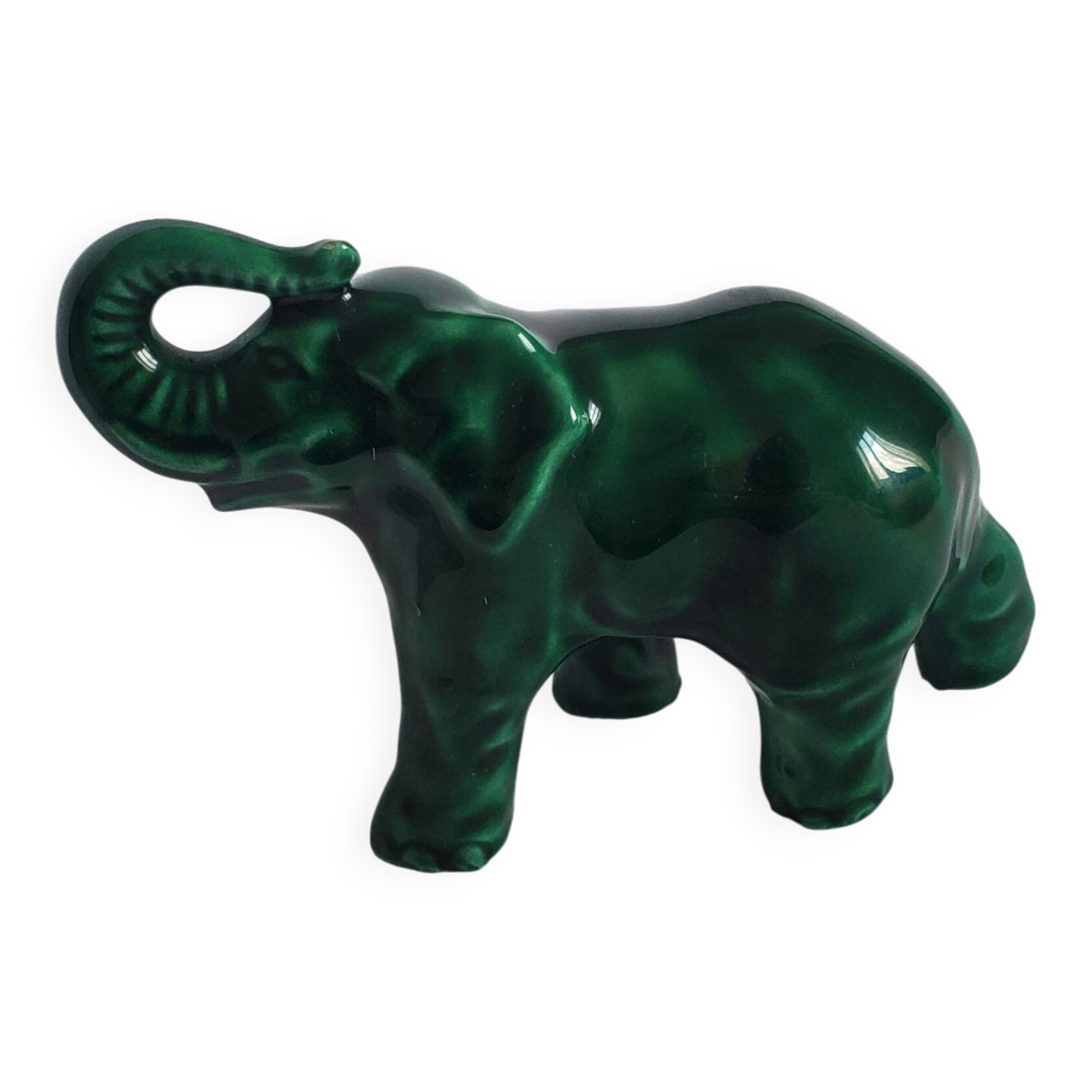 Small emerald green ceramic elephant.