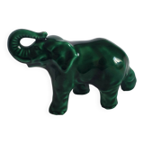 Small emerald green ceramic elephant.