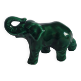 Small emerald green ceramic elephant.