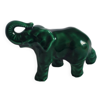 Small emerald green ceramic elephant.