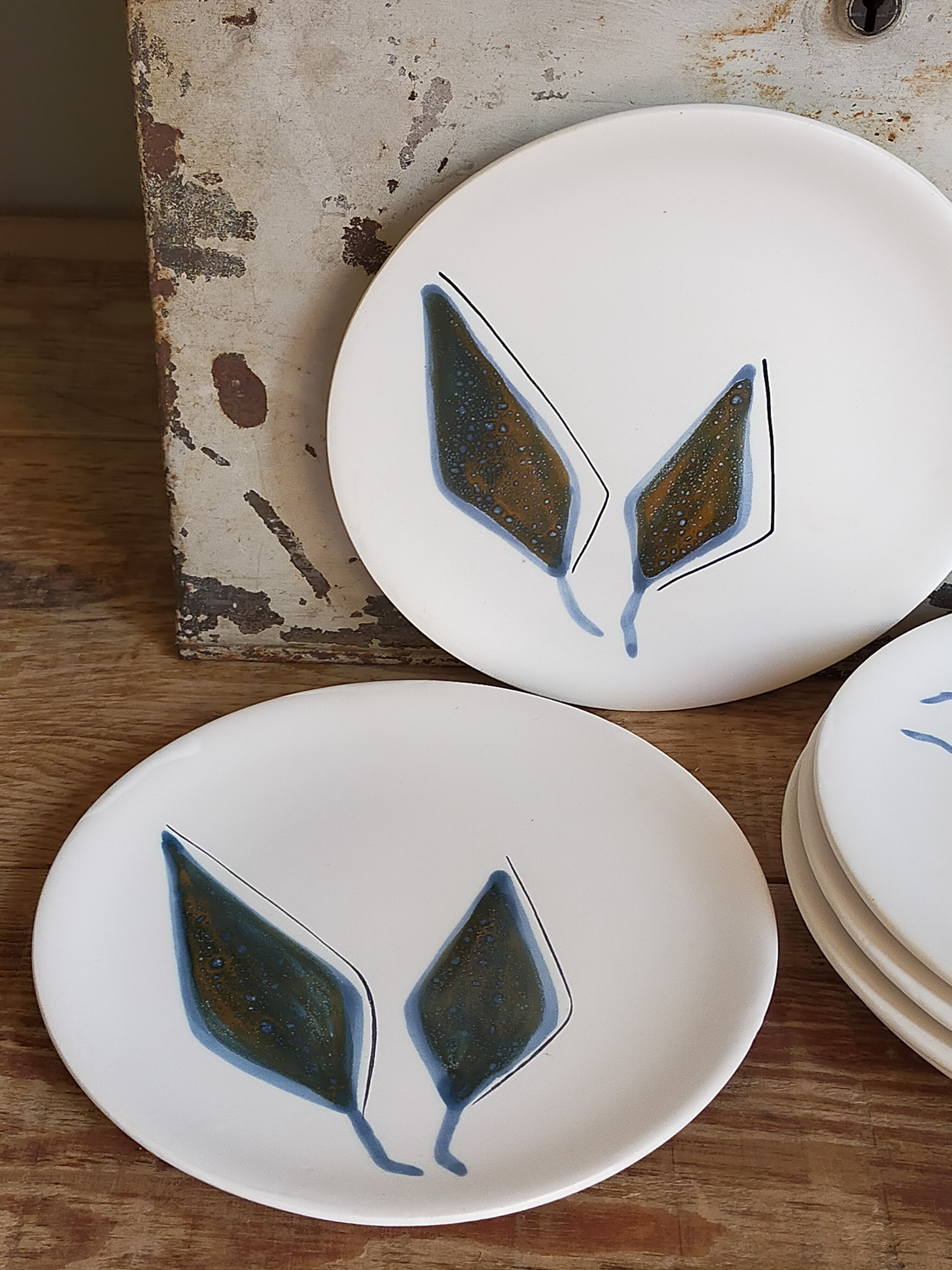 Six ceramic plates with matt enamel 50s