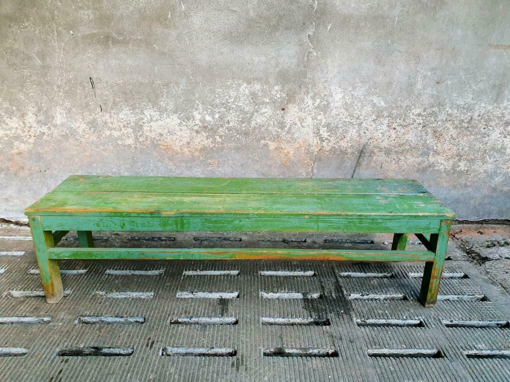 Old wooden bench sidetable green