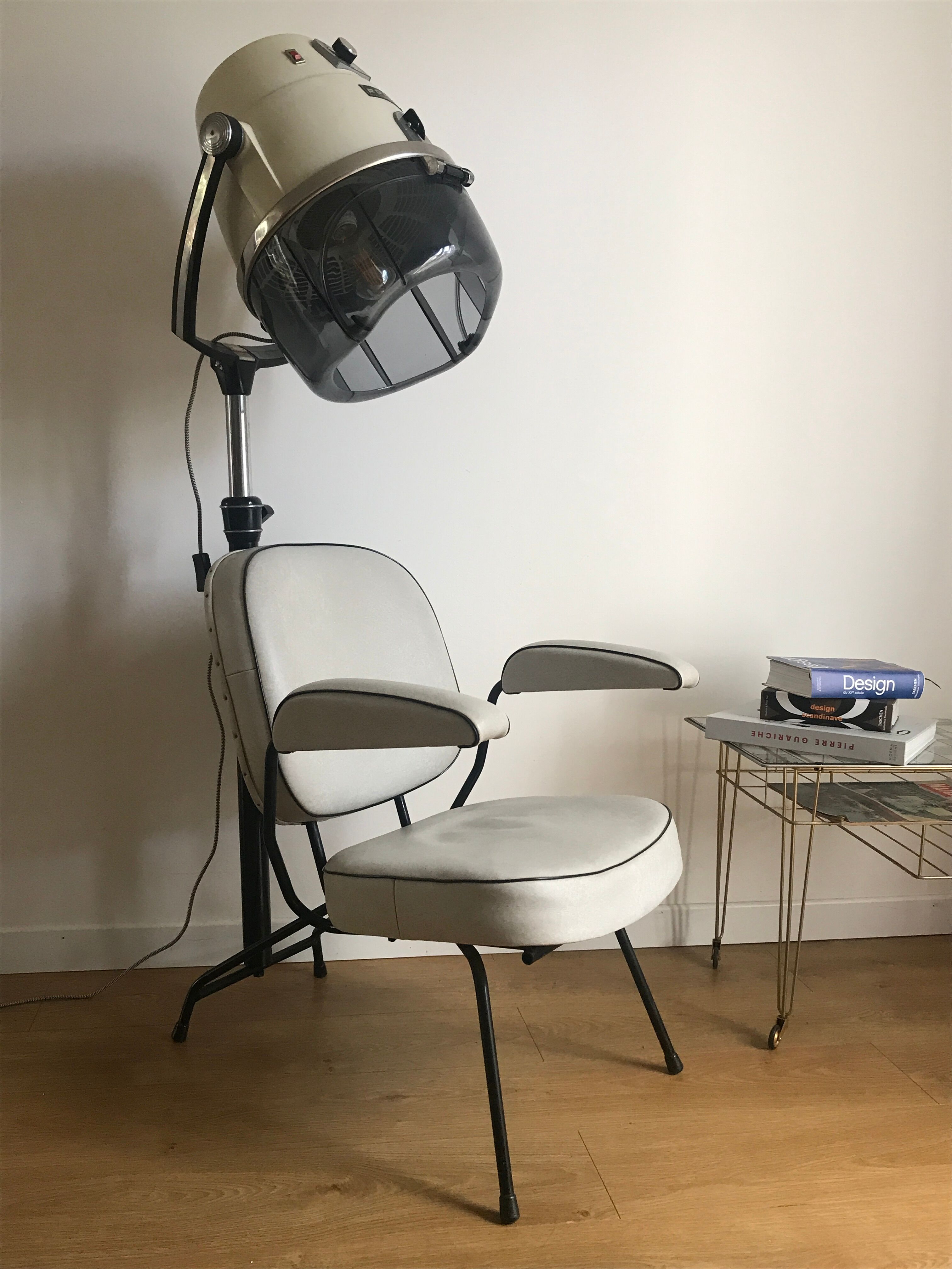 Vintage hairdresser's armchair with helmet transformed into a lamp