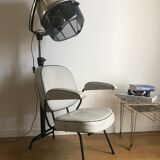 Vintage hairdresser's armchair with helmet transformed into a lamp