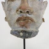 Face sculpture in polychrome earth and plaster, cabinet of curiosities. Ph Monaux. Ariège artist