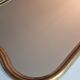 Vintage baroque style mirror, with curved frame in stucco and gilded wood 57 cm