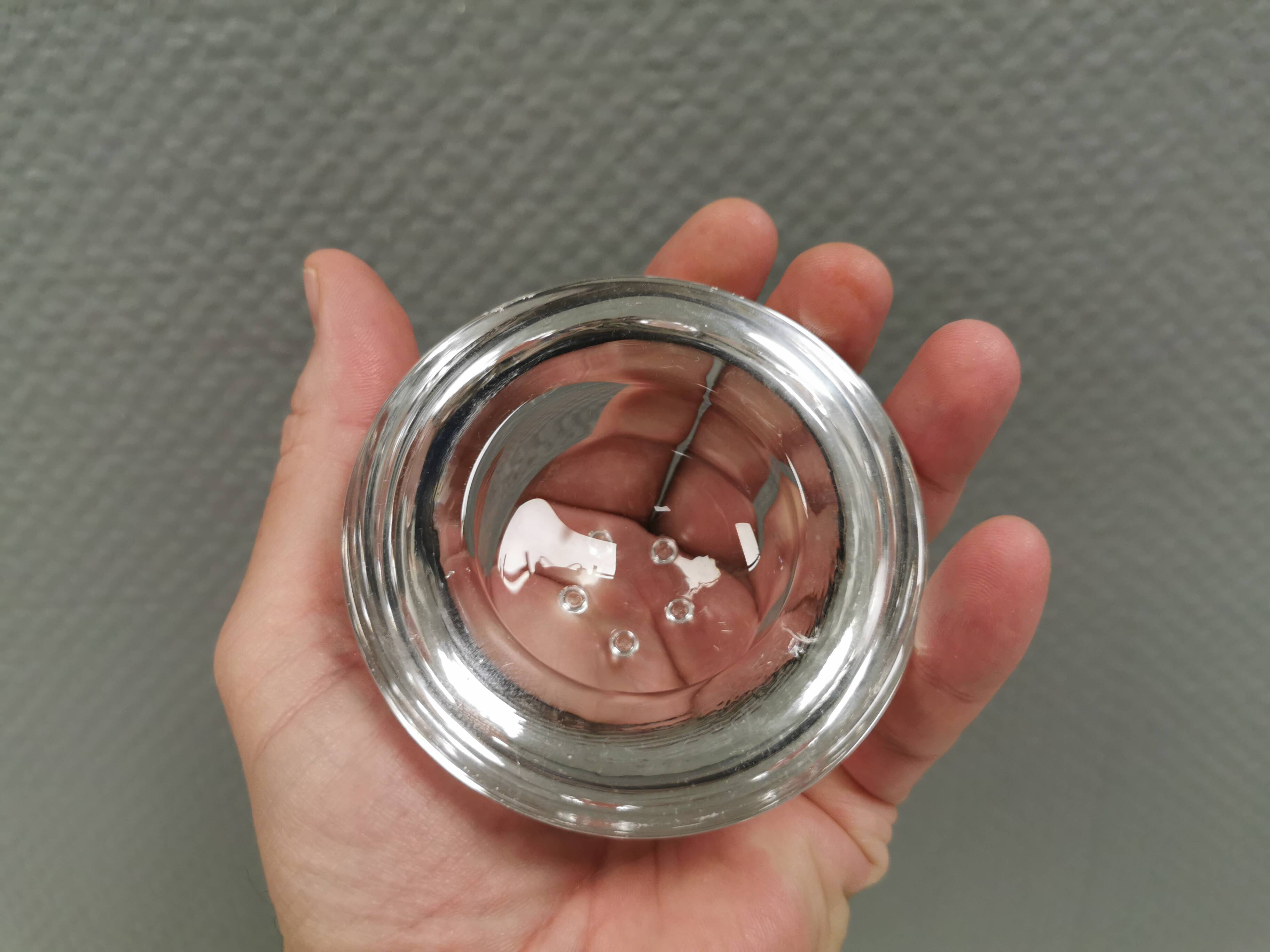 A set of iittala candle holders in clear transparent glass.