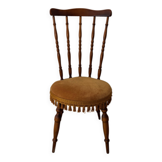 Wooden chair with yellow velvet