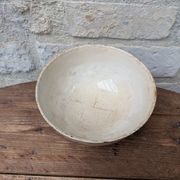 Old opaque porcelain bowl from Gien with a floral decoration.