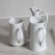 3 old French pitchers in white ceramic