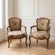 Pair of Louis XV armchairs in floral fabric and wood