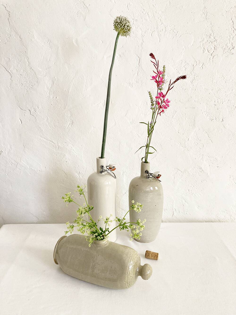 Trio of stoneware hot water bottles, three models