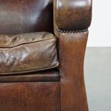 Sheep leather armchair with round shapes