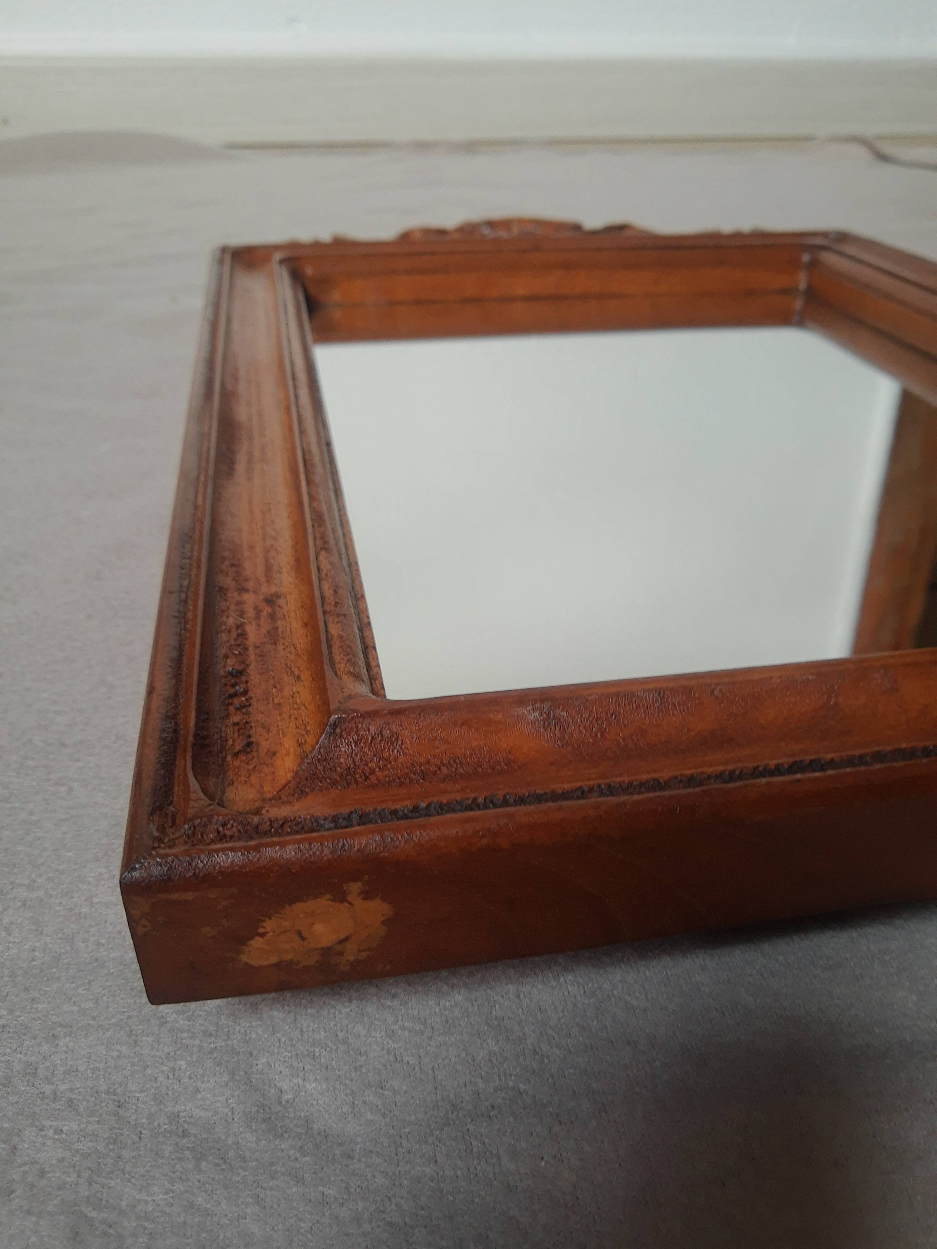 Wooden hanging mirror with vintage carved knot