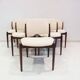 Set of six hardwood chairs by Arne Vodder for Sibast with white textile upholstery.