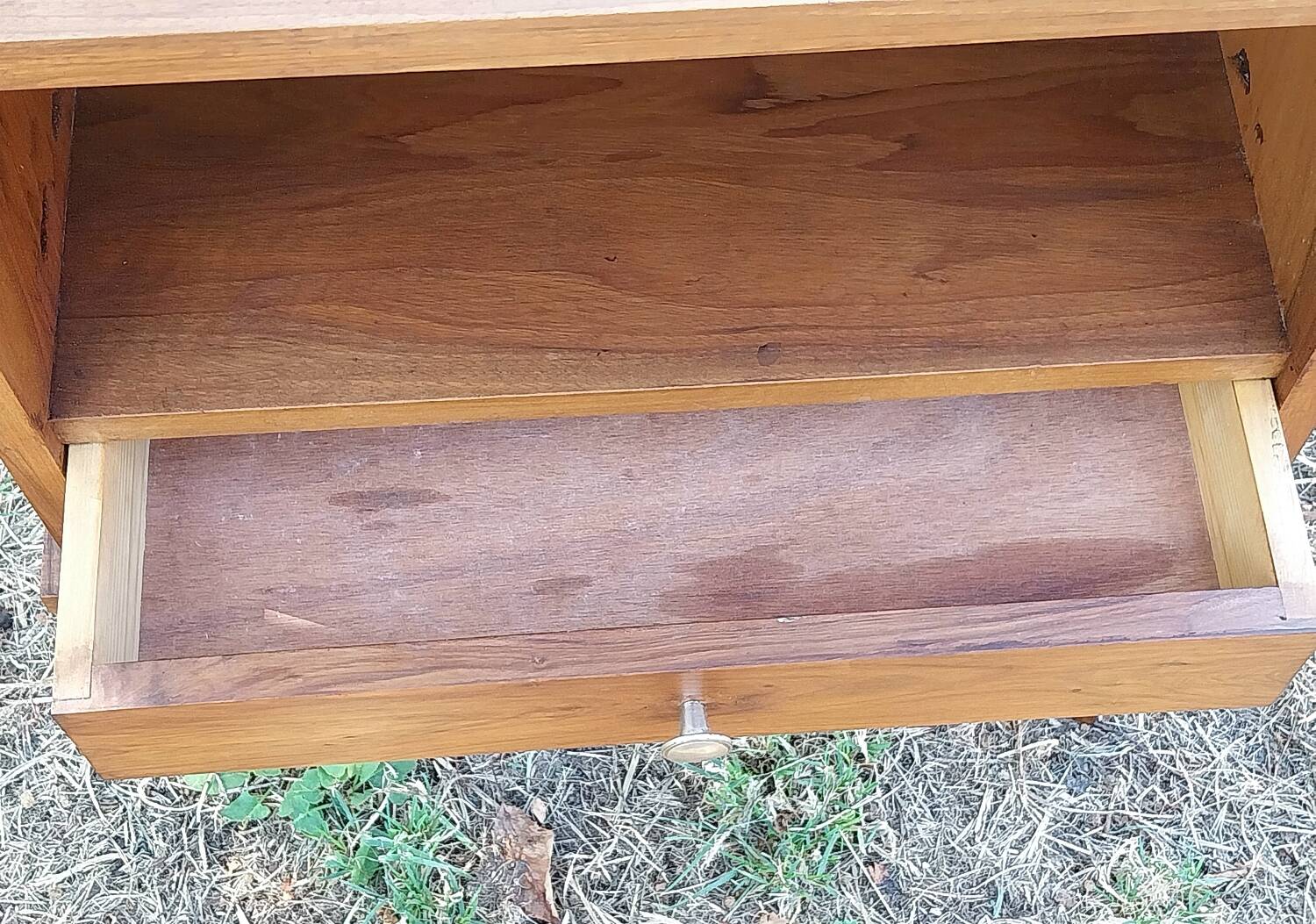 Wooden bedside table with compass feet