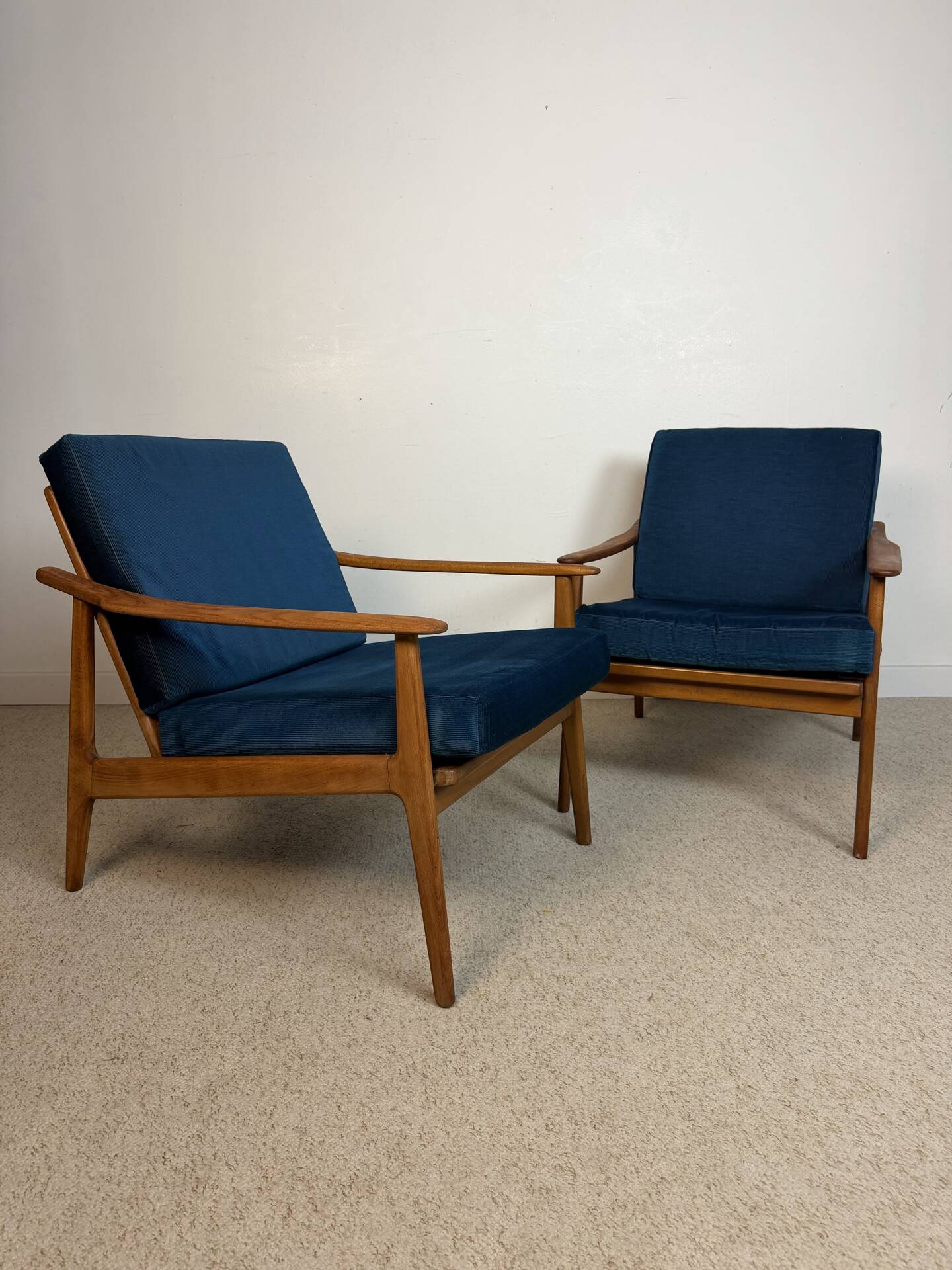 a pair of Scandinavian armchairs in teak from the 1960s