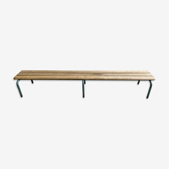 Vintage wood kindergarten bench and tubular structure in long