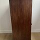 Vintage bedside table in the shape of a wooden column and a gray marble top