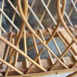 Rattan cradle with arrow
